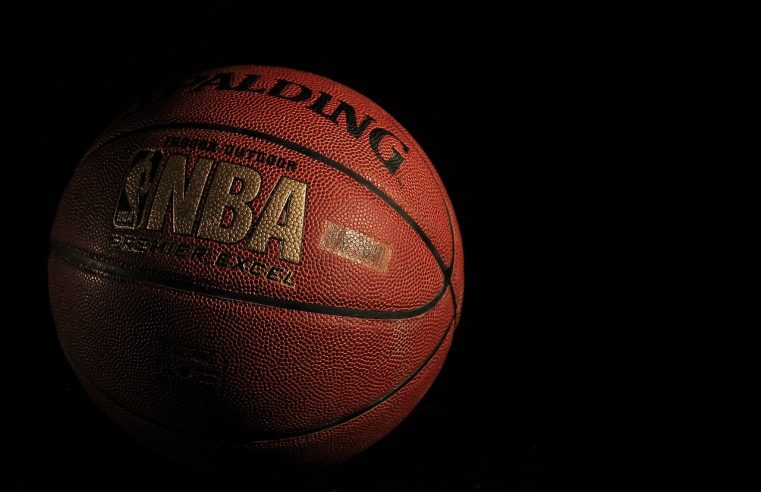 Basketball ball with the NBA logo with the black background.