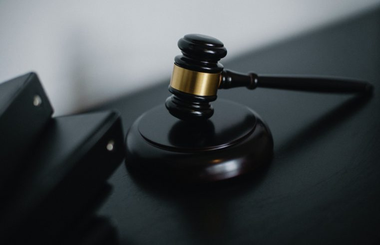 Black gavel on the black desk